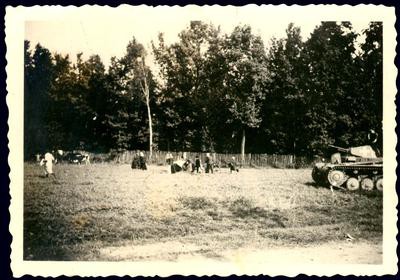 Rybnik, Poland, People and a tank in a field.